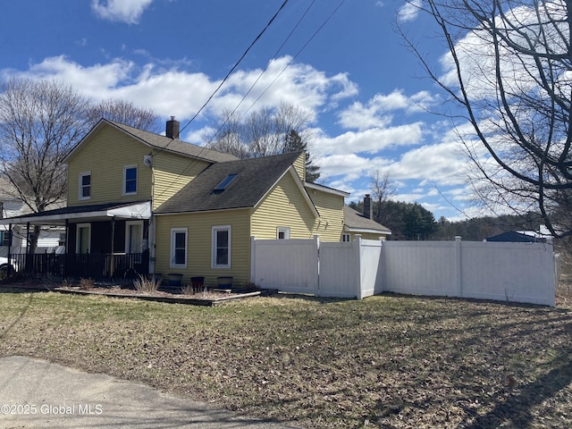 470 Middle Grove Rd, Greenfield, NY 12850 - view of home's exterior featuring a shingled roof, a chimney, covered porch, and fence