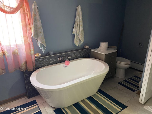 470 Middle Grove Rd, Greenfield, NY 12850 - bathroom featuring a freestanding bath, tile patterned flooring, and toilet