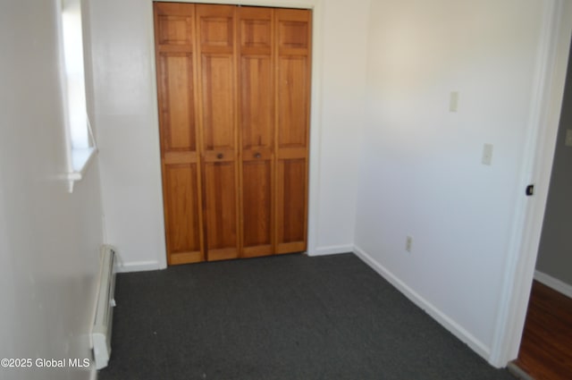178 Spring St, Albany, NY 12203 - unfurnished bedroom featuring baseboards, dark colored carpet, and a closet