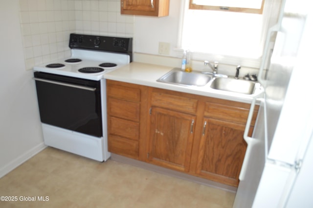 178 Spring St, Albany, NY 12203 - kitchen featuring white appliances, a sink, tasteful backsplash, brown cabinets, and light countertops