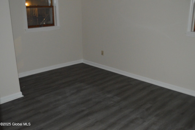 178 Spring St, Albany, NY 12203 - spare room with dark wood-style floors and baseboards