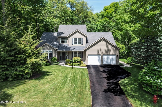 11 Newport Dr, Clifton Park, NY 12065 - traditional-style house with driveway, a garage, a front lawn, and roof with shingles