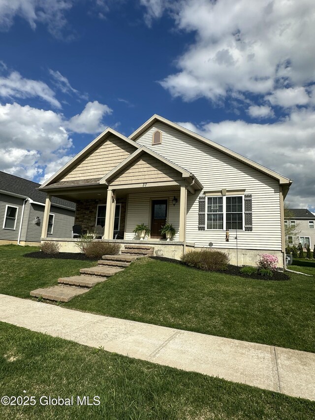 37 Nantucket St, Colonie, NY 12047 - view of front of house with a porch and a front yard