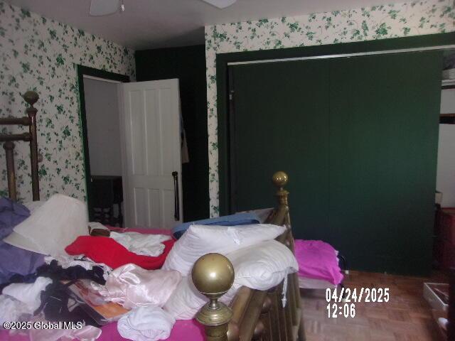 bedroom featuring wallpapered walls