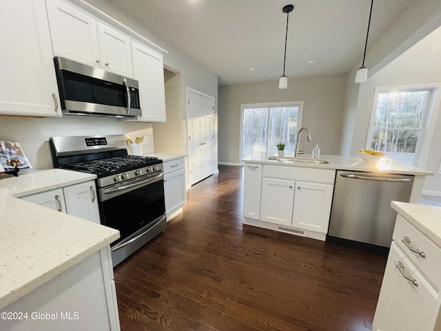10 Hunter Ct, Milton, NY 12020 - kitchen with dark wood finished floors, stainless steel appliances, a sink, white cabinetry, and visible vents