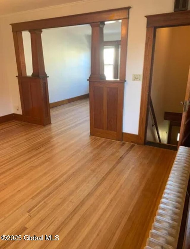 unfurnished room featuring light wood-style floors and baseboards