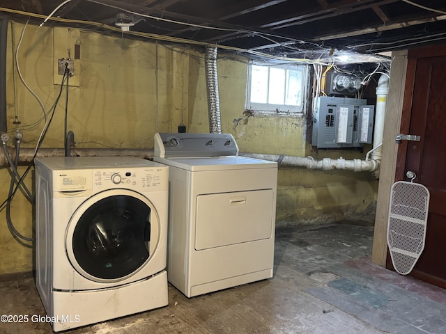 laundry room featuring washer and dryer, electric panel, and laundry area