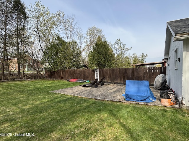 view of yard with a fenced backyard and a patio area