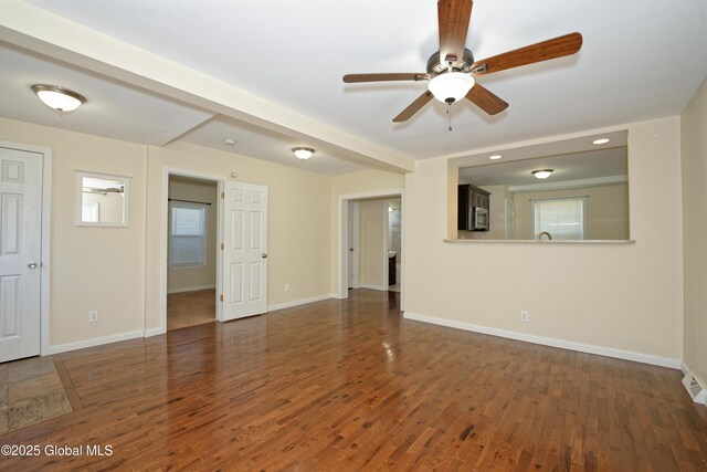 unfurnished living room with ceiling fan, baseboards, wood finished floors, and recessed lighting
