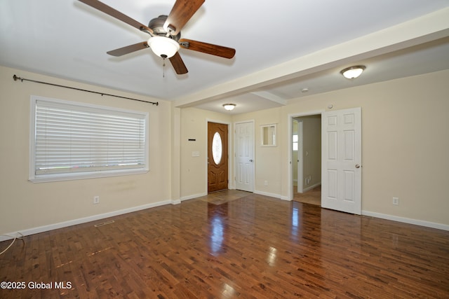 interior space featuring wood finished floors, baseboards, a wealth of natural light, and ceiling fan