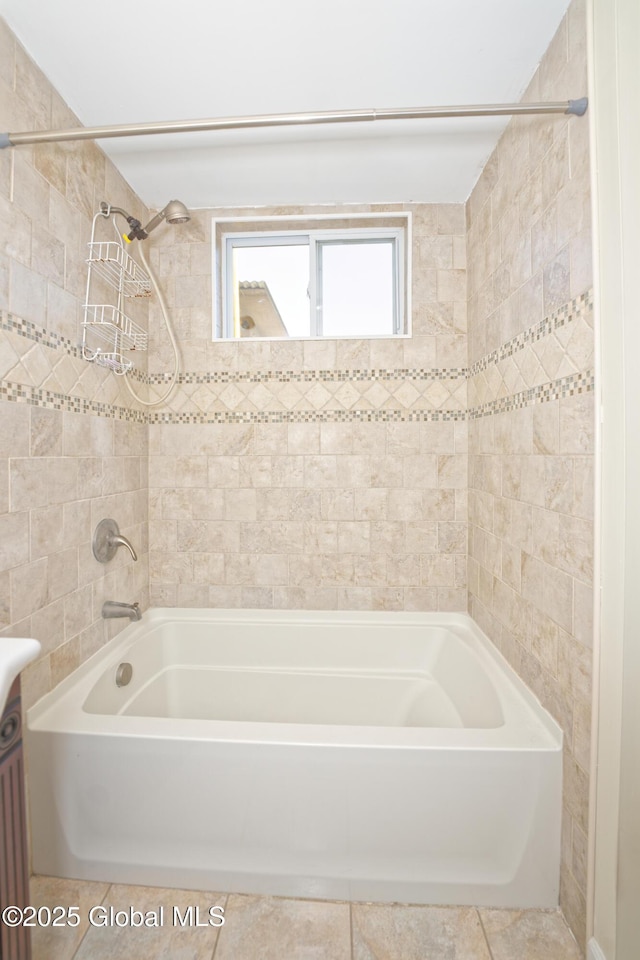 bathroom featuring vanity, tile patterned flooring, and tub / shower combination