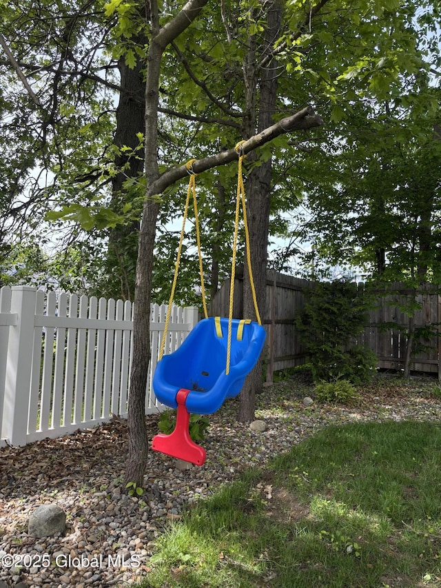 21 St Charles Pl, Saratoga Springs, NY 12866 - fenced backyard with a playground