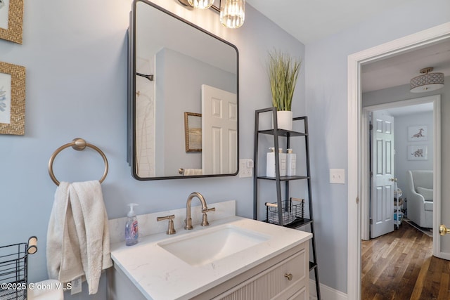 21 St Charles Pl, Saratoga Springs, NY 12866 - bathroom featuring wood finished floors, vanity, and baseboards