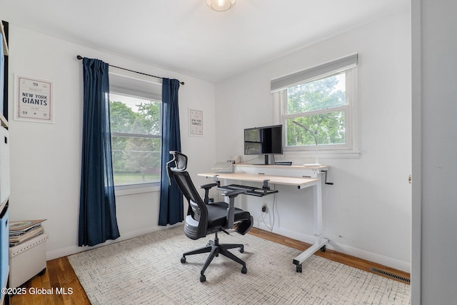 21 St Charles Pl, Saratoga Springs, NY 12866 - home office featuring wood finished floors and baseboards
