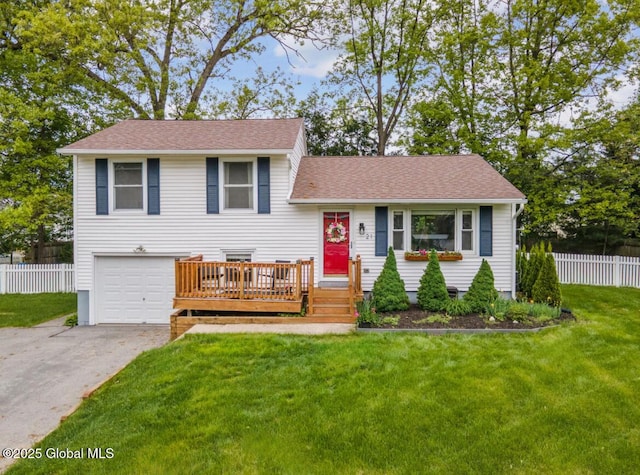 21 St Charles Pl, Saratoga Springs, NY 12866 - tri-level home with asphalt driveway, an attached garage, a deck, and a shingled roof