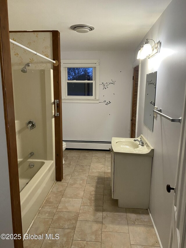 bathroom featuring toilet, a baseboard radiator, vanity, and tile patterned flooring