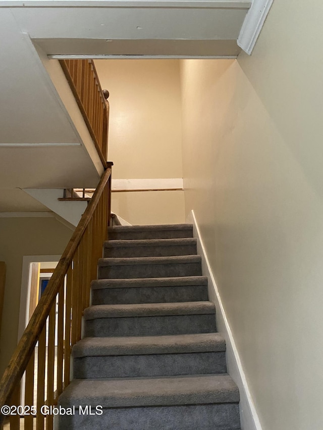 stairs featuring ornamental molding