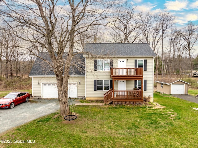 view of front of home featuring a front lawn, driveway, a balcony, and roof with shingles
