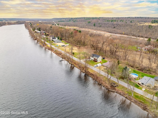 aerial view at dusk with a water view