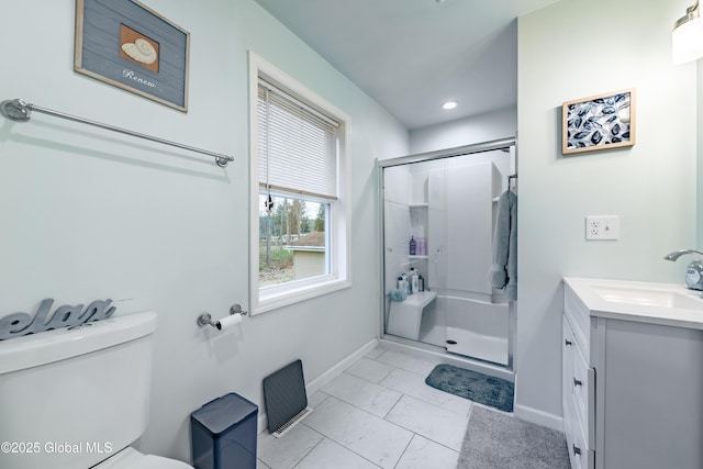 full bathroom with toilet, baseboards, marble finish floor, a shower stall, and vanity
