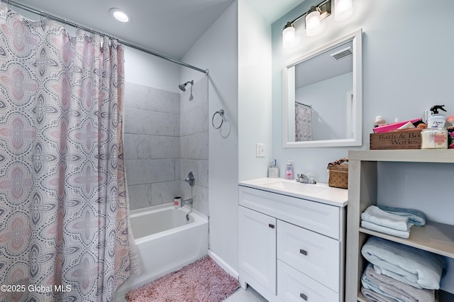 bathroom featuring shower / bath combo, vanity, and visible vents