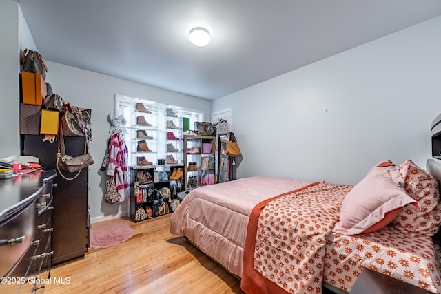 bedroom with light wood-style floors