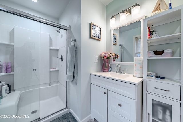 bathroom featuring vanity and a stall shower