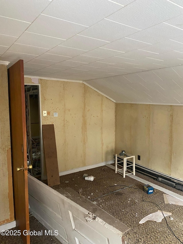 spare room with vaulted ceiling