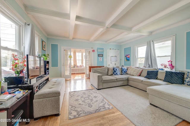 living area featuring beam ceiling, coffered ceiling, and wood-type flooring