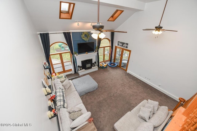 2196 Darrow Rd, Duanesburg, NY 12056 - carpeted living area featuring beam ceiling, a large fireplace, a ceiling fan, and high vaulted ceiling