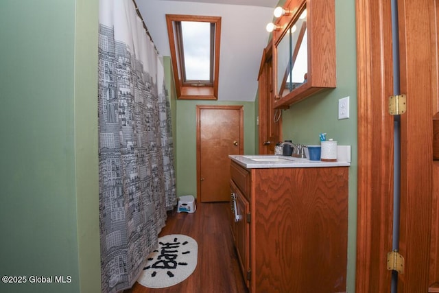 2196 Darrow Rd, Duanesburg, NY 12056 - bathroom featuring a shower with curtain, vanity, and wood finished floors