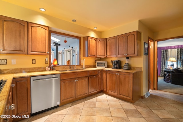 63 Pawling Ave, Mechanicville, NY 12118 - kitchen with light tile patterned floors, brown cabinets, a sink, dishwasher, and recessed lighting