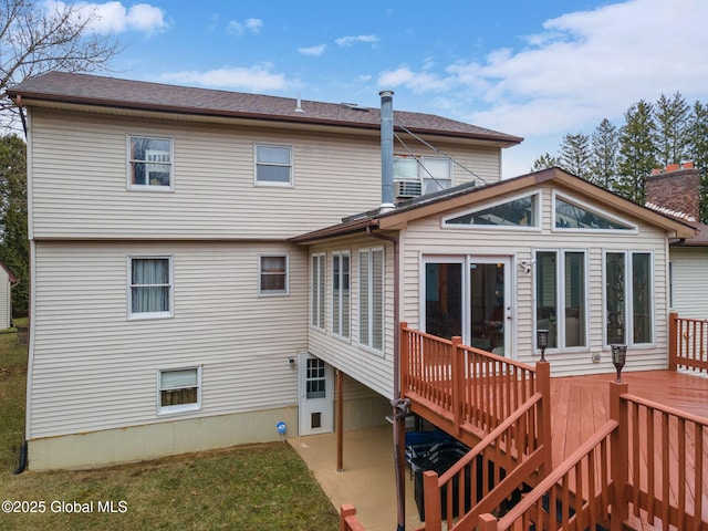 63 Pawling Ave, Mechanicville, NY 12118 - back of property with a chimney, stairs, a wooden deck, and a sunroom