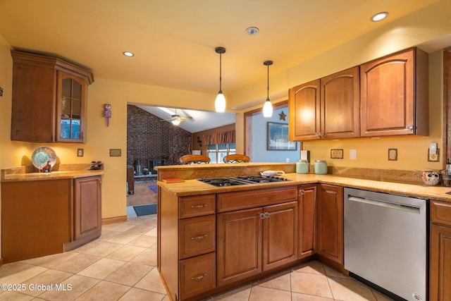 63 Pawling Ave, Mechanicville, NY 12118 - kitchen with light tile patterned floors, appliances with stainless steel finishes, pendant lighting, a peninsula, and lofted ceiling