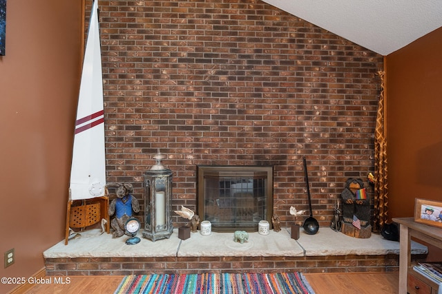 63 Pawling Ave, Mechanicville, NY 12118 - room details with a brick fireplace, wood finished floors, and baseboards
