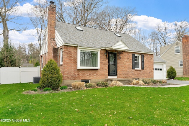 bungalow with fence, a shingled roof, brick siding, a front yard, and a chimney