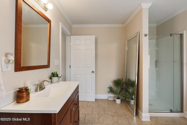full bathroom featuring vanity, ornamental molding, baseboards, and a shower stall