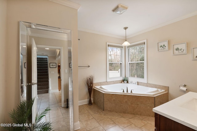 bathroom featuring a garden tub, crown molding, visible vents, vanity, and tile patterned floors