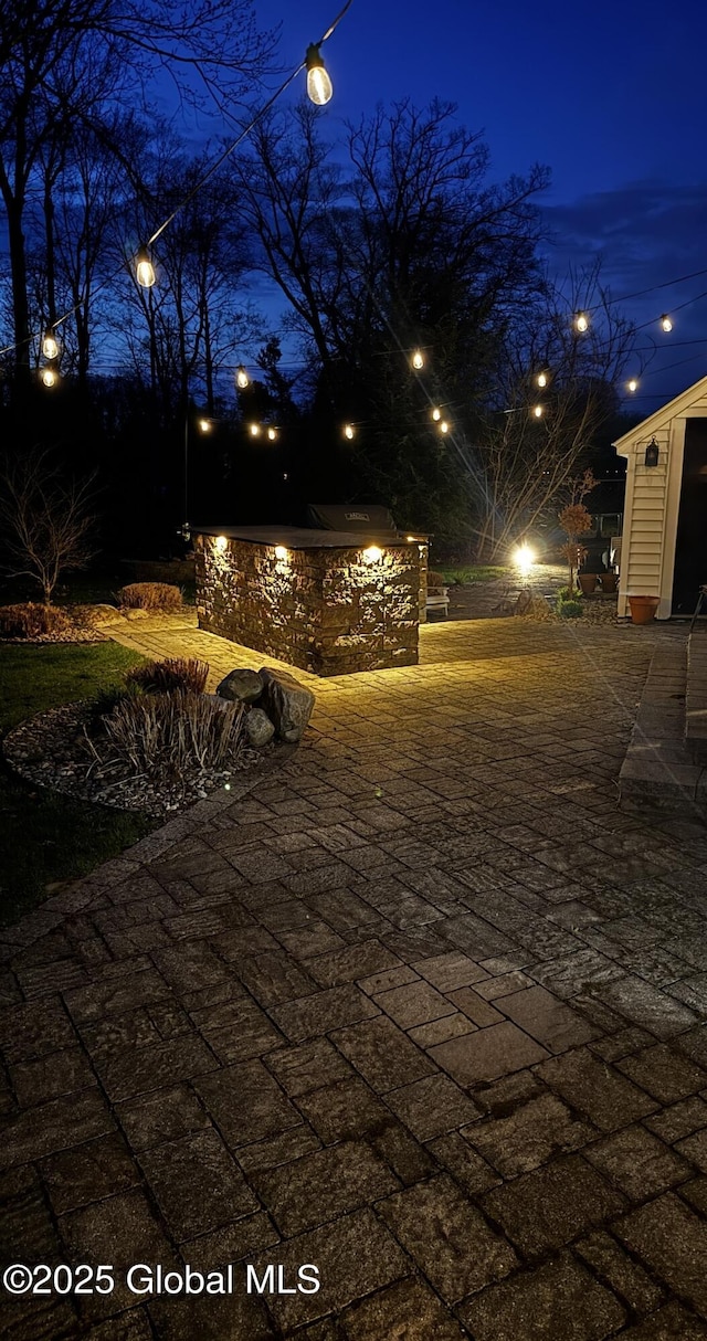 yard at twilight featuring an outdoor structure