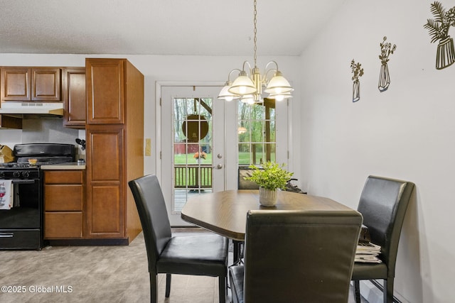 dining area featuring an inviting chandelier