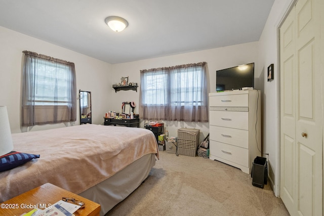 bedroom with light colored carpet