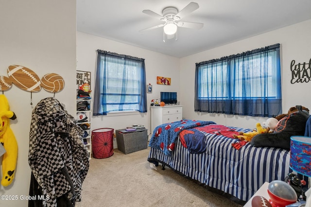 carpeted bedroom with ceiling fan