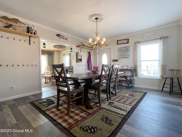 dining area featuring baseboards, wood finished floors, a notable chandelier, and crown molding
