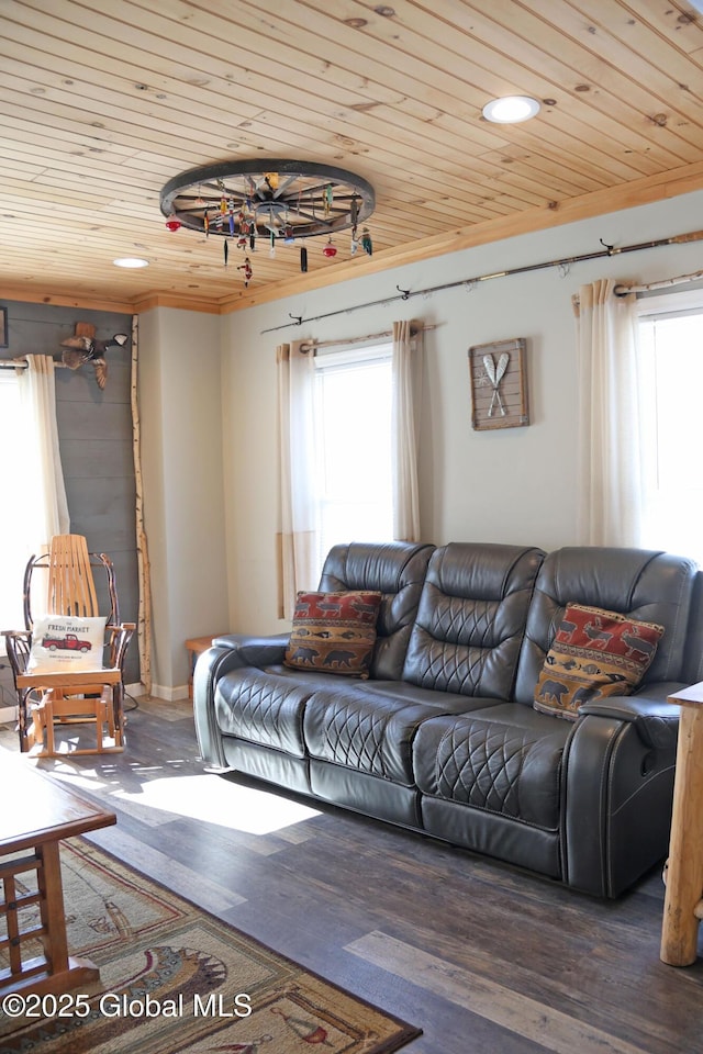 living room with crown molding, wood finished floors, and wood ceiling
