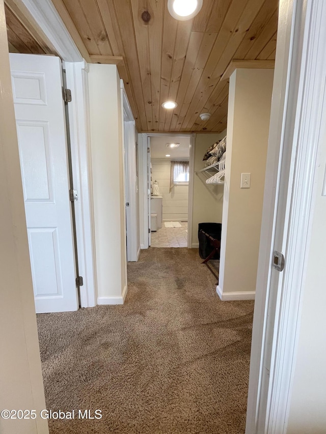 hallway with recessed lighting, carpet flooring, washer / dryer, baseboards, and wood ceiling
