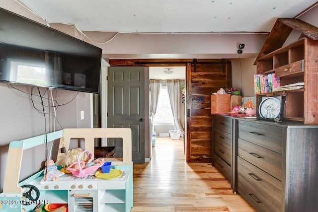 bedroom with light wood-type flooring