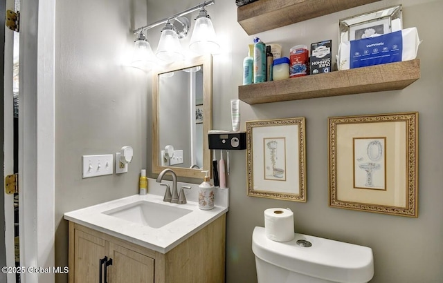 bathroom with toilet and vanity