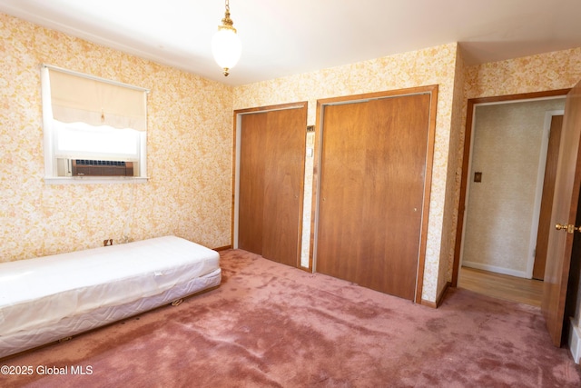 19 Centennial Dr, Queensbury, NY 12804 - carpeted bedroom with wallpapered walls, two closets, and cooling unit