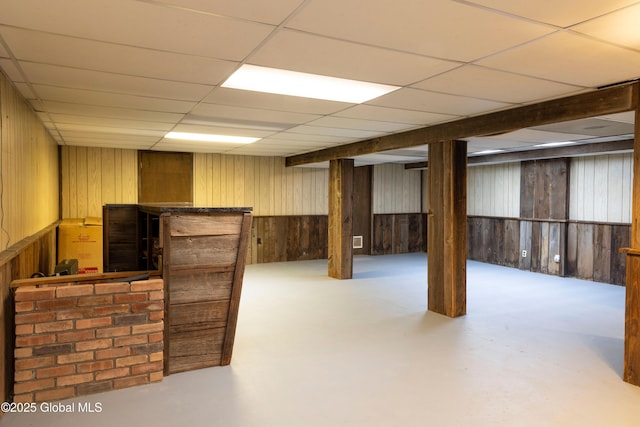 19 Centennial Dr, Queensbury, NY 12804 - finished basement with wood walls, a bar, and a paneled ceiling