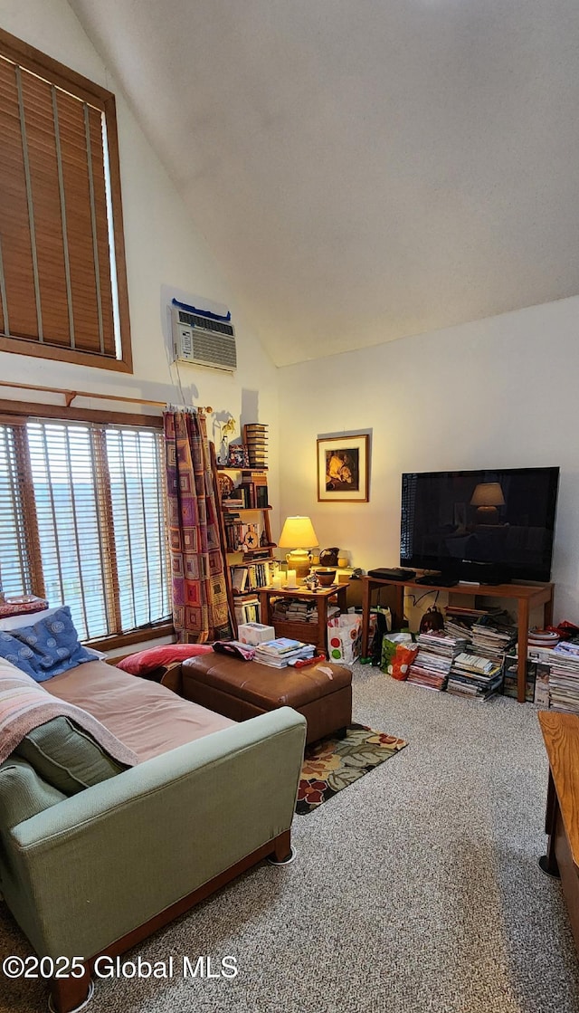 living room featuring an AC wall unit, carpet flooring, and vaulted ceiling